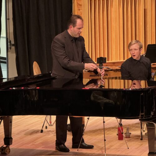 I took this photo while John Kylkema was adjusting something. The trumpet player's face pure comedy.